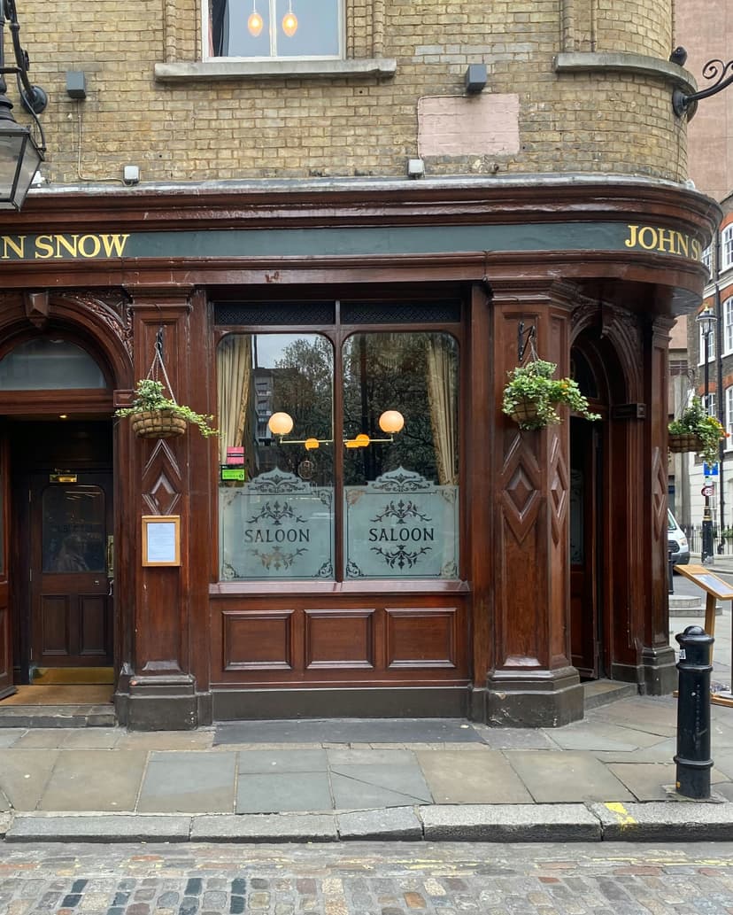 Traditional Irish pub exterior with colorful facade and hanging flower baskets